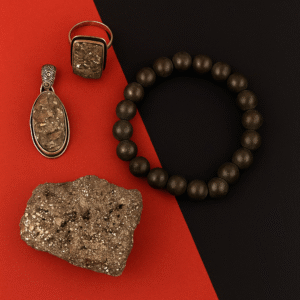 Pyrite collection set with natural pyrite stone, bracelet, ring, and locket for wealth and abundance